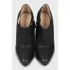 High-heeled leather ankle boots