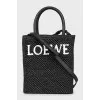 Woven crossbody bag with tag