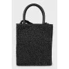 Woven crossbody bag with tag