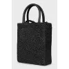 Woven crossbody bag with tag
