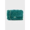 Crossbody bag decorated with fur