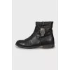 Leather boots decorated with a skull