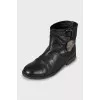Leather boots decorated with a skull