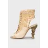Textile sandals with shaped heels