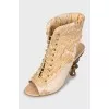 Textile sandals with shaped heels