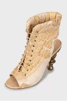 Textile sandals with shaped heels
