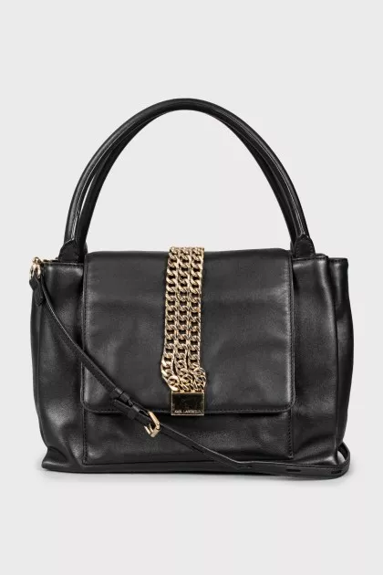 Leather bag decorated with chains
