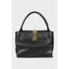 Leather bag decorated with chains