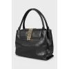 Leather bag decorated with chains