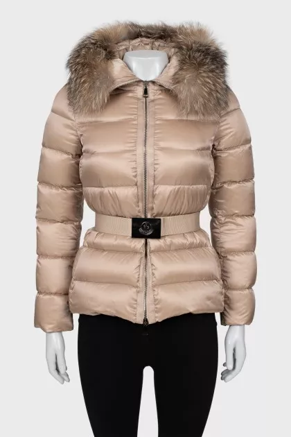 Beige down jacket with fur on the hood
