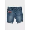 Denim shorts decorated with embroidery