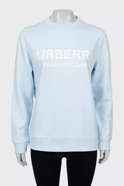 Light blue sweatshirt with text print