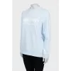 Light blue sweatshirt with text print