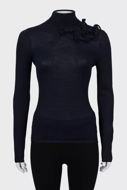 Knitted golf shirt decorated with bows