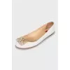 White leather ballet shoes with decor
