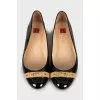 Black patent ballerinas