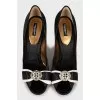 Textile shoes decorated with a bow