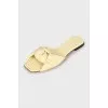 Yellow leather slides