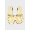 Yellow leather slides