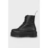 Black leather lace-up boots