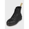 Black leather lace-up boots