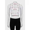 Top decorated with embroidery
