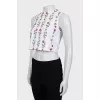 Top decorated with embroidery