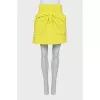 Yellow skirt decorated with a bow