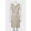 Golden dress decorated with a brooch