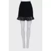 Black mini skirt with ruffled hem
