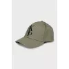 Green cap with company logo