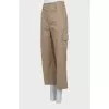 Beige trousers with pockets