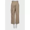 Beige trousers with pockets
