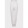 White trousers with tag