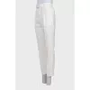 White trousers with tag