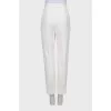 White trousers with tag