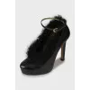 Leather shoes decorated with fur