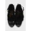 Leather shoes decorated with fur