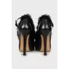 Leather shoes decorated with fur