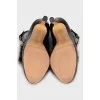Leather shoes decorated with fur