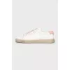 White sneakers with brand logo