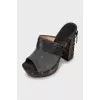 Clogs with leather inserts and metal rivets