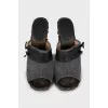 Clogs with leather inserts and metal rivets