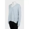 Blue pullover extended at the back
