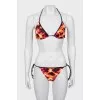 Swimsuit in abstract print with tag