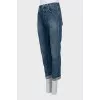 Dark blue jeans with raw hem