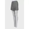 Short skirt in houndstooth print with tag
