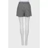 Short skirt in houndstooth print with tag