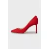 Red suede pumps