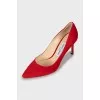 Red suede pumps